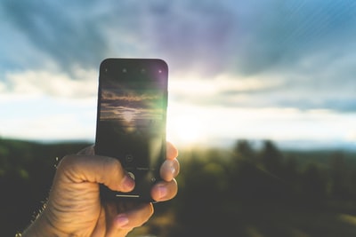 Holding a black smartphone
